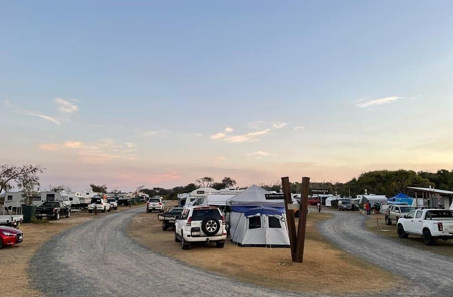 a caravan park on the side of a river